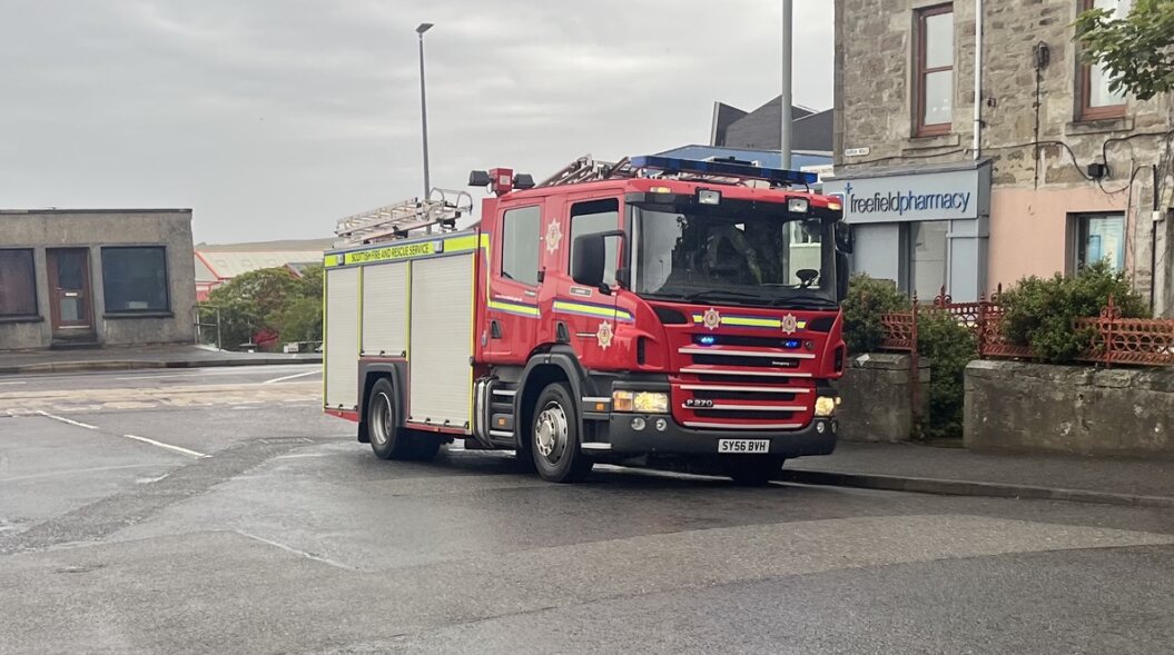 firefighters-free-person-trapped-in-phone-box 